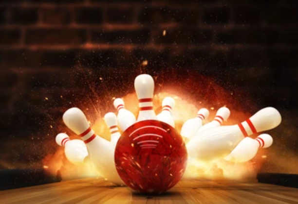 bowling ball knocking over bowling pins with flames