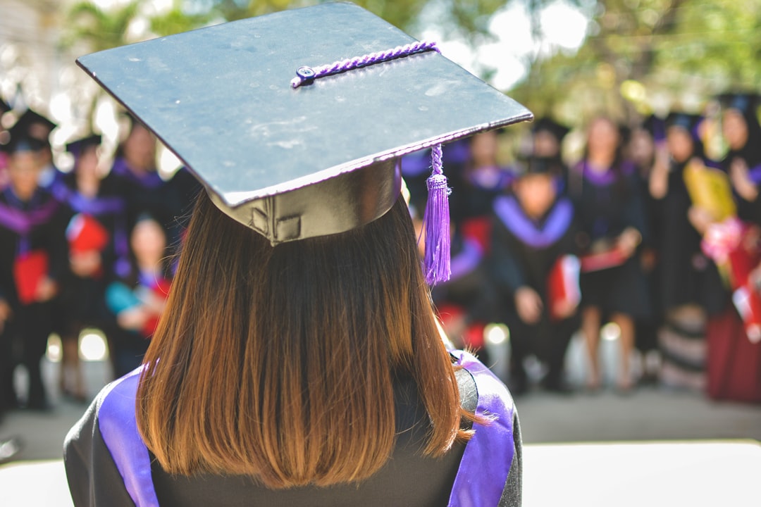 woman wearing academic cap and dress selective focus photography woman wearing academic cap and dress selective focus photography